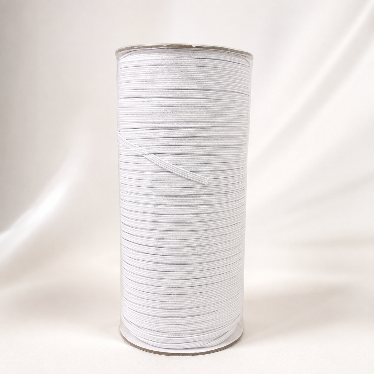 Close-up of 3mm white braided elastic showing the braided weave