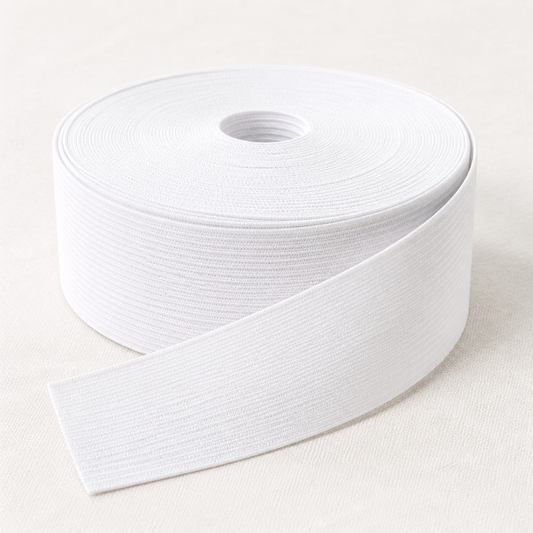 Reel of wide woven elastic of the type used for girth and saddlery elastic
